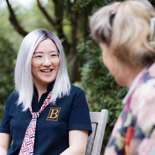 a woman riding a bike down a street